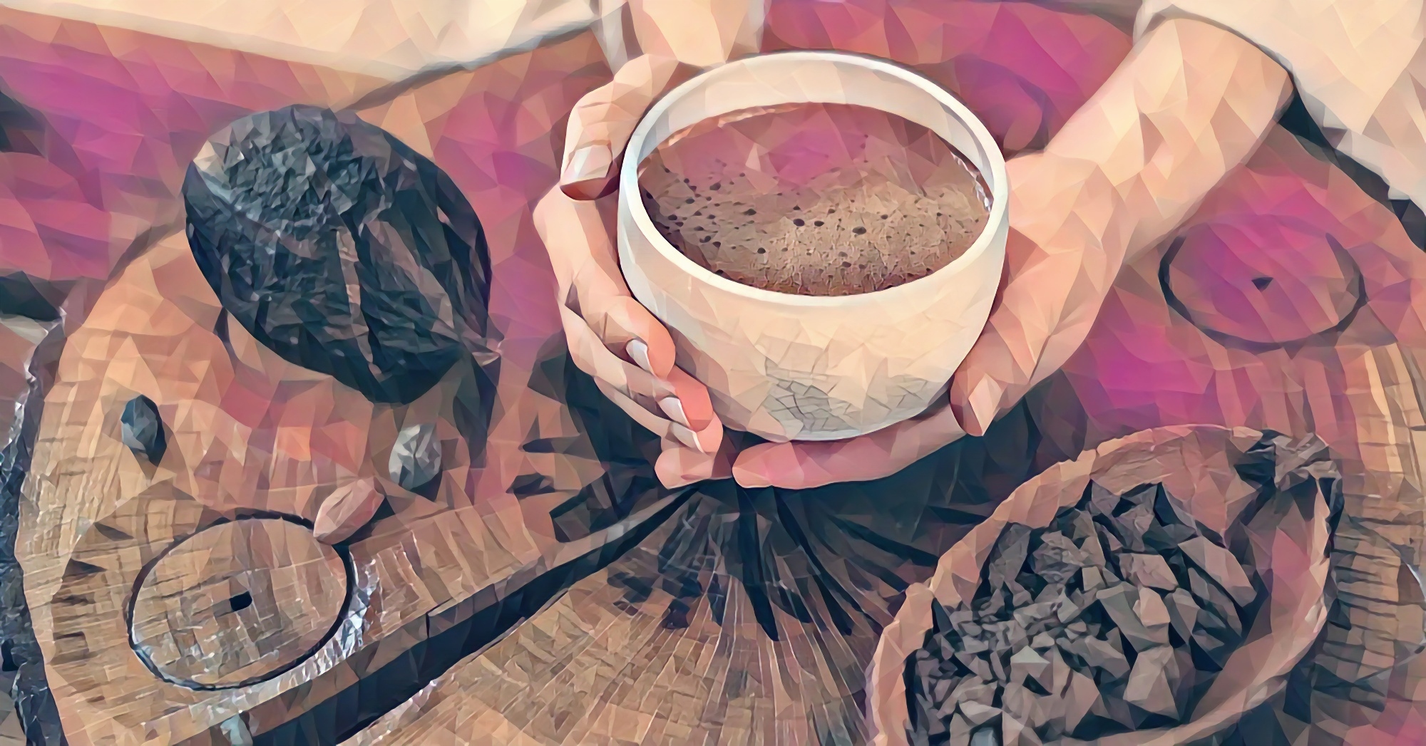 Ceremonial cacao held in cupped hands, surrounded by crystals and dried botanicals — the opening of a Heart Opener session at the Denver Zen Den